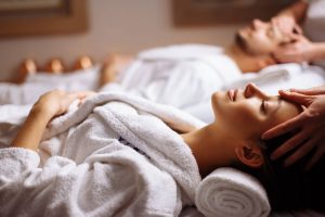 happy-young-beautiful-couple-enjoying-head-massage-spa-scaled-e1624554987511